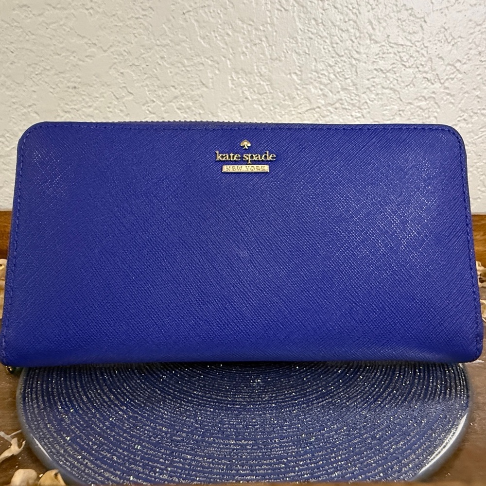Kate Spade royal blue zip-around saffiano wallet with gold logo